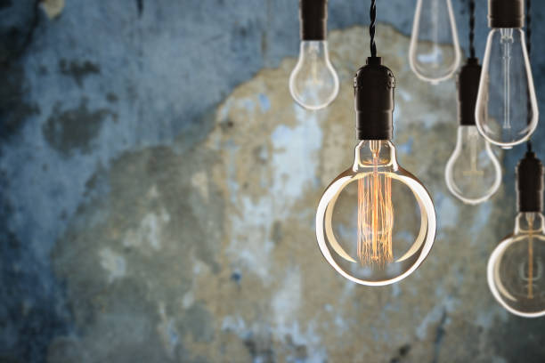 istock Idea and leadership concept Vintage incandescent Edison bulbs on 1351113124
