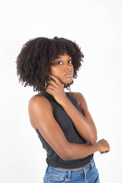 istock pretty afro american woman posing on white background 1351114686