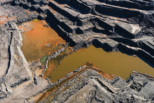 Aerial drone view of an open pit gypsum mine.