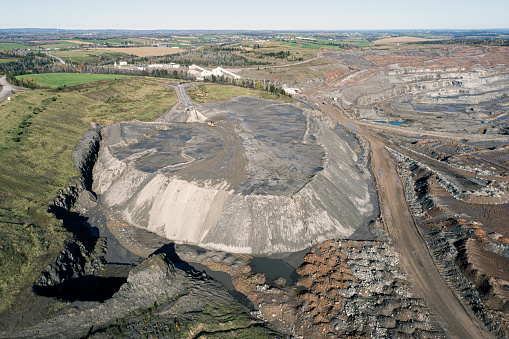 Aerial drone view of an open pit gypsum mine.