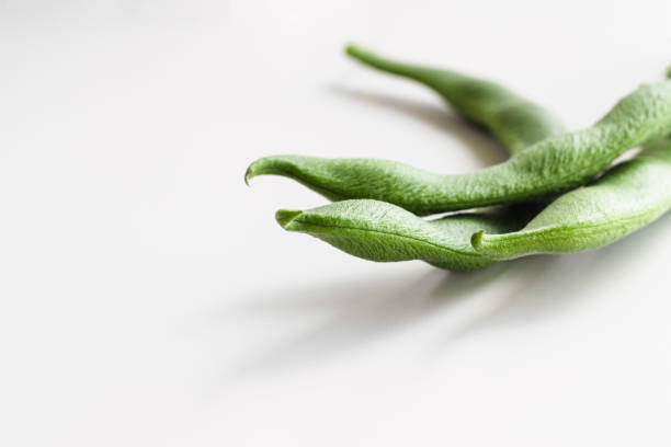 Green bean pods, located on the right. Space for text.
