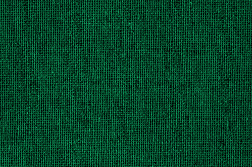Green Dark Background Burlap Sack Jute Linen Woven Fabric Grid Pattern Grid Deep Teal Christmas Texture Copy Space Macro Photography Design template for presentation, flyer, card, poster, brochure, banner
