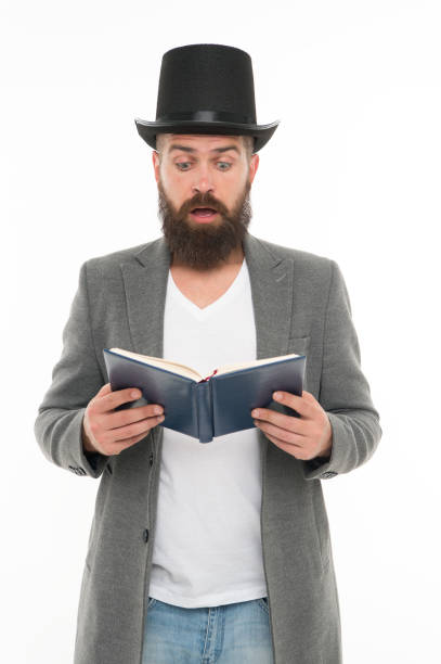 istock Reading dramatic scenario. Bearded man read book isolated on white. Poetry reading. Inspirational book. Literature teacher. Books shop. Interesting story. Guy classic outfit read book. Dramatic look 1351119963