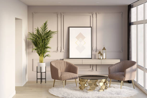 istock Exquisite living room with a vertical poster on a console next to a classic muted pink wall, armchairs near a coffee table, a curtain next to a large window, a palm tree next to a doorway. 1351121525