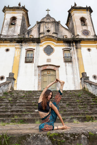 istock Latin woman practicing yoga in front of ancient building. 1351121759