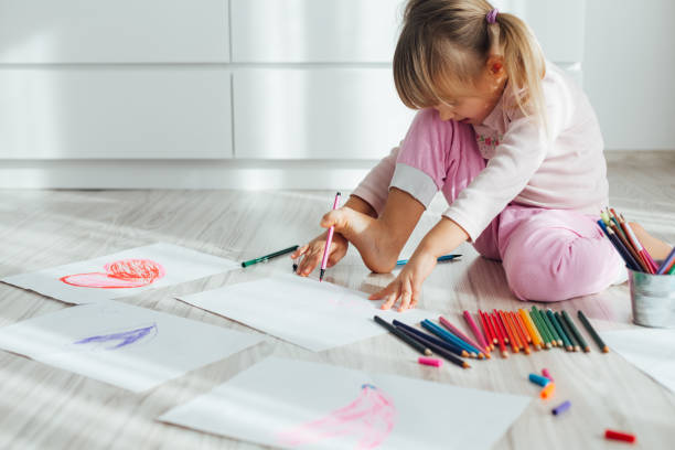 istock Little Girl Drawing 1351124170