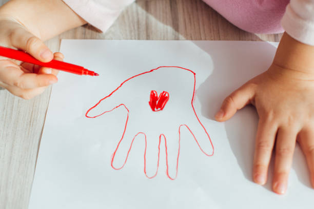 istock Little Girl Drawing 1351124210