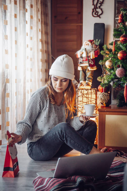 istock Opening a gift on a video call during Christmas hollidays 1351124537
