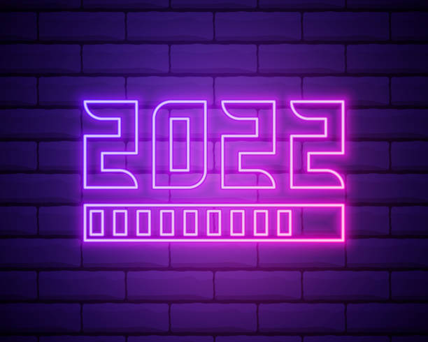 istock 2022 neon signboard. Happy New Year. Realistic pink neon numbers on dark brick wall. Vector 2022 in neon linear style 1351126675