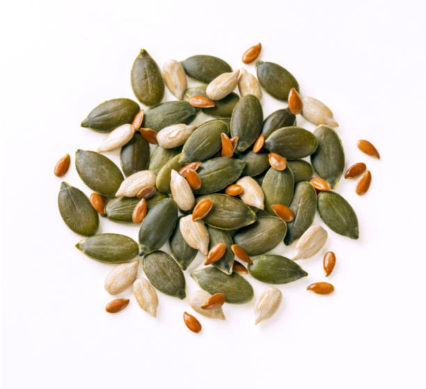 istock Pumpkin, sunflower, flax seeds mix isolated on white. 1351126713