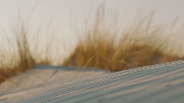 Slow motion view of sunset on the beach in Sardinia, Italy.