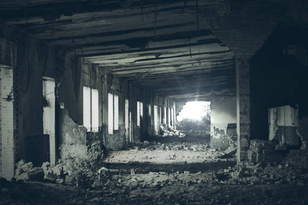 abandoned building interior, ruins of industrial factory, dark corridor in scary abandoned premises - building exterior obsolete abandoned damaged imagens e fotografias de stock