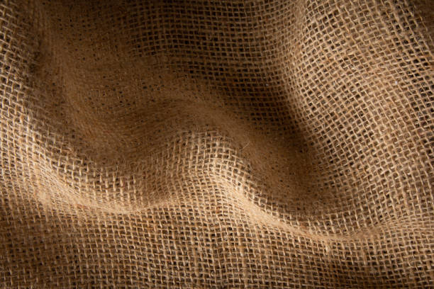 fond avec texture en fibre de jute beige. - sackcloth textured textured effect burlap photos et images de collection