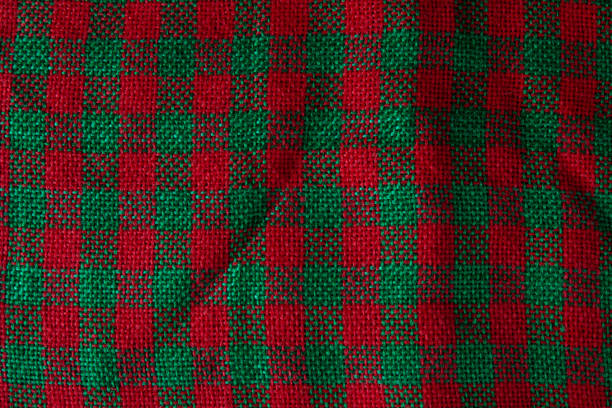 istock Background with red and green checkered jute fiber texture. 1351130114