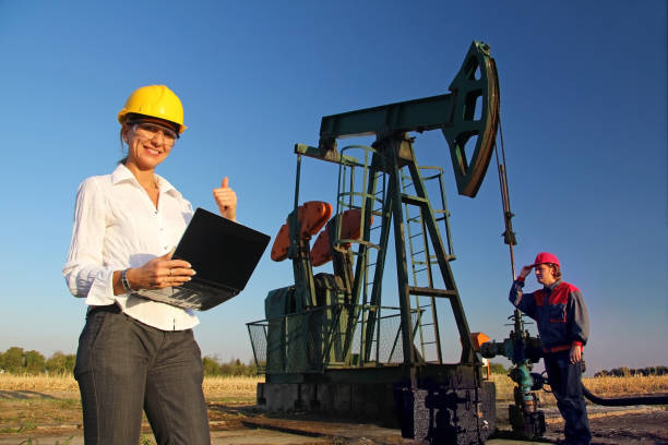 istock Workers in an oilfield 1351131802