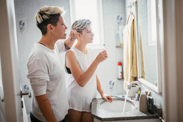 istock Lesbian couple at home, having morning routine in bathroom 1351131821