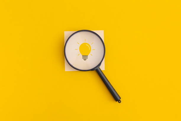 istock Light bulb on yellow background. Inspiration and creative idea concept. Top view. Flat lay. 1351133718