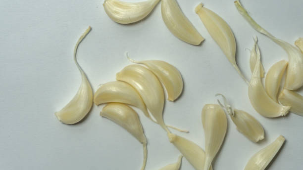 istock Healthy garlic on a white background. Garlic spice on white. 1351141313