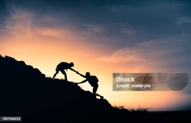 Hikers Helping Each Other Stock Photo - Download Image Now - Mountain, Clambering, Sunset