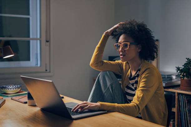 istock Business Woman Using Laptop Computer at Night 1351146376