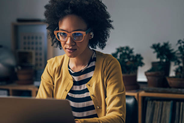 istock Business Woman Using Laptop Computer at Night 1351146394