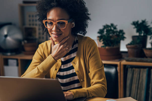 istock Business Woman Using Laptop Computer at Night 1351146397
