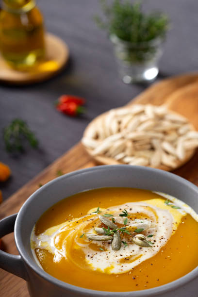 istock Pumpkin and carrot soup with cream 1351149222