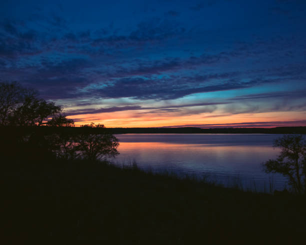 istock Blue and Orange Sunset over Lake 1351150092