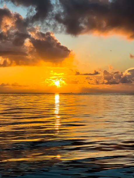 istock Quiet Orange Sunset over Calm Waters 1351150116