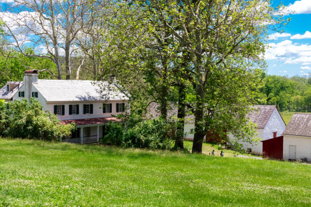 istock Rural Farmhouse in Green Yard 1351150133