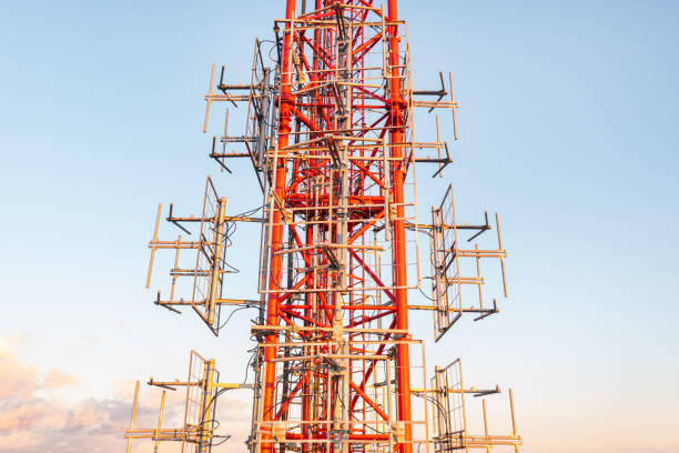 istock Telecommunication tower with antennas on blue sky background 1351150155
