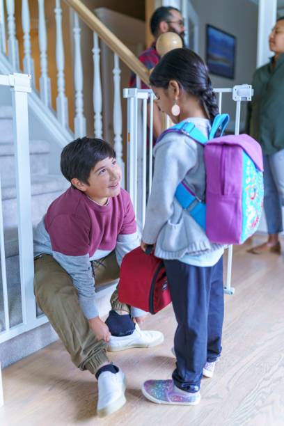 istock Siblings getting ready to walk to school 1351150350