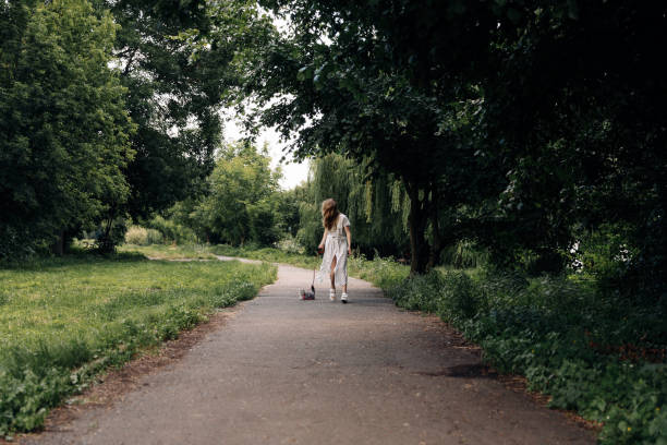 istock Woman in a mask walks with a cat 1351151501