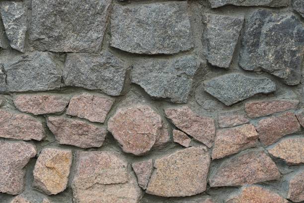 istock gray brown texture of stones in the wall 1351152978