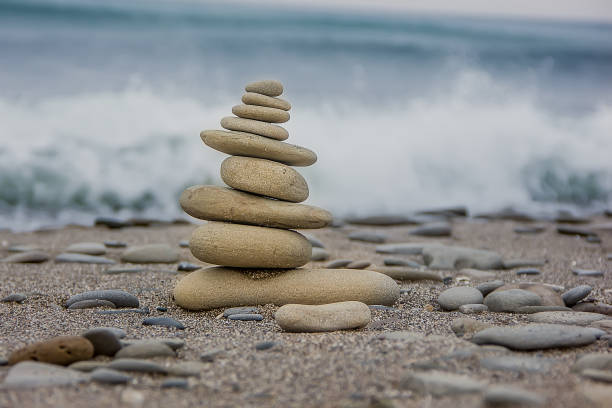 istock A pyramid of stones on the seashore. 1351152994