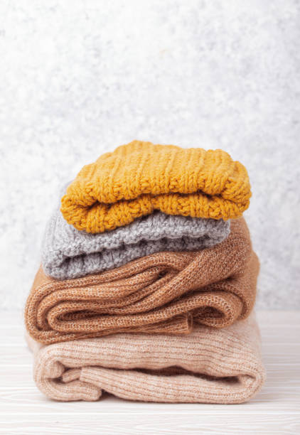 istock Pile of warm knitted clothes 1351154577