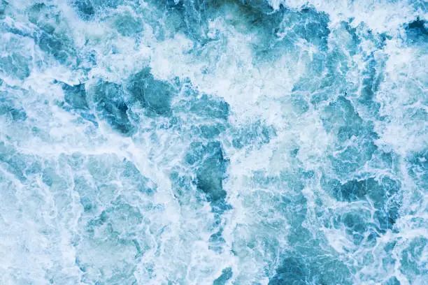 Photo of Strong swirl of water for the background. Water waves