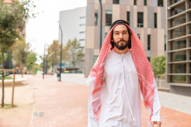 istock Arab man walking on street 1351154952