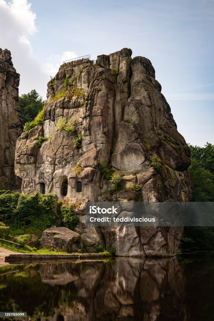 The famous Externsteine rock formation in the Teutoburg Forest, Germany The Externsteine, a prominent sandstone rock formation in the Teutoburg Forest, near the town of Horn-Bad Meinberg in the district of Lippe in North Rhine-Westphalia (Germany). The Externsteine are an outstanding natural sight in Germany, protected as a natural and cultural monument of historical significance. Externsteine Stock Photo