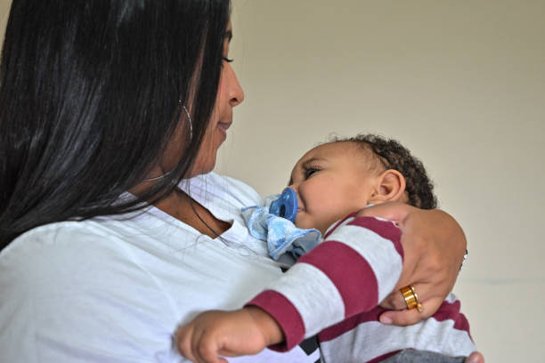istock Young mom and her baby at home 1351155284