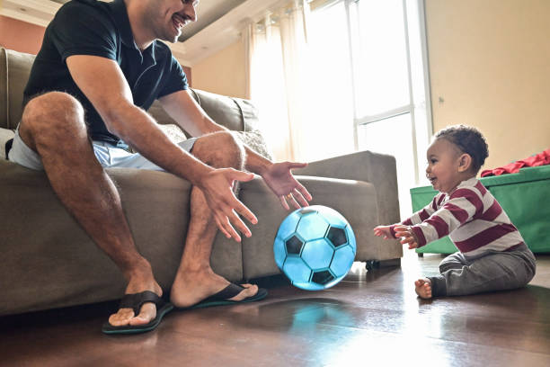 istock Cute baby playing with his dad 1351156355