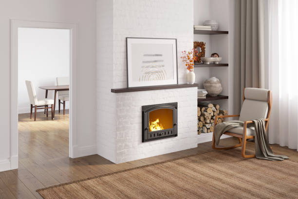 una habitación acogedora con un póster horizontal y flores en un jarrón en la repisa de la chimenea, una mecedora cerca de la chimenea, un nicho con decoración cerca de la ventana, una puerta con vistas al comedor. - fireplace living room door wall fotografías e imágenes de stock