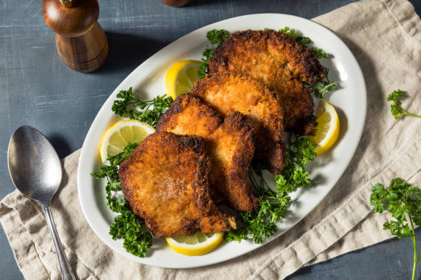 homemade fried pork chops - karbonade stockfoto's en -beelden