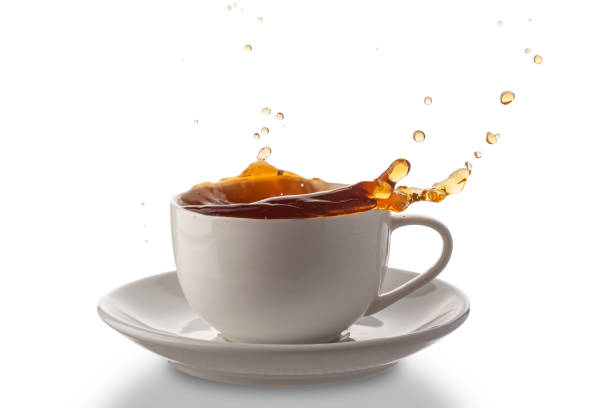istock white porcelain cup with spilled tea, isolated on a white background 1351158308