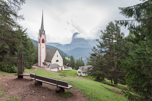 St. Giacomo little church among a wide green woods in Val Gardena area