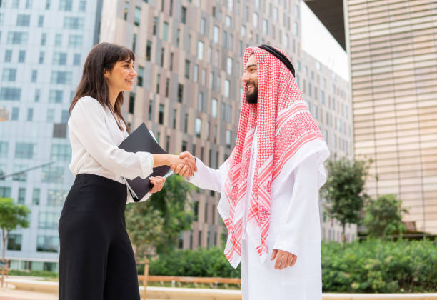 istock Diverse man and woman shaking hands during meeting 1351162779