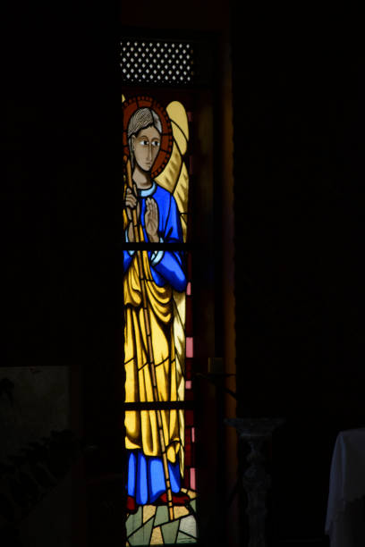 istock Colorful stained glass windows from a Catholic church. 1351163106