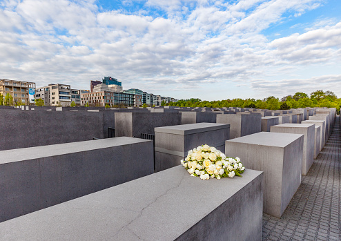 Berlin, Germany - May 3, 2016: Holocaust Memorial on Berlin, various gray cubes to remember murdered people
