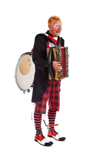 istock Clown winth accordion and drum on his back 135116592