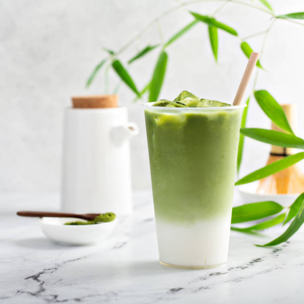 istock Cold matcha latte in a tall glass on marble 1351167328